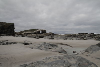 Rocks on land against sky