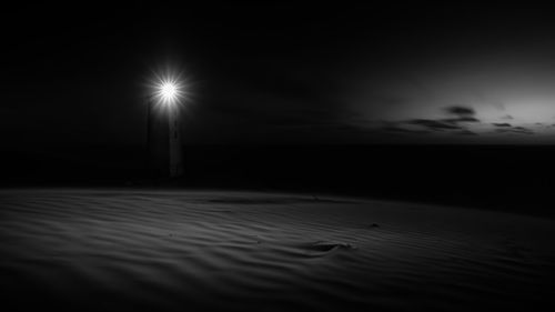 Scenic view of sea against sky at night