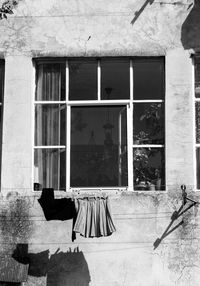 Clothes drying on window of building