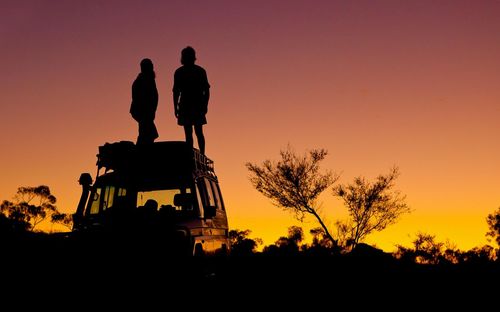 Silhouette people at sunset