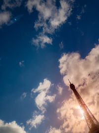 Low angle view of crane against sky