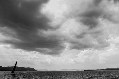 Scenic view of sea against cloudy sky