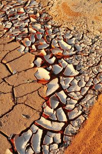 Close-up of pebbles on sand