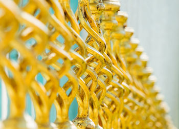 Close-up of golden metallic balustrade