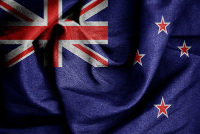 Close-up of flag on blue wall