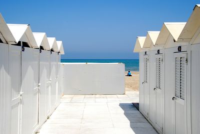 Built structures against clear blue sky