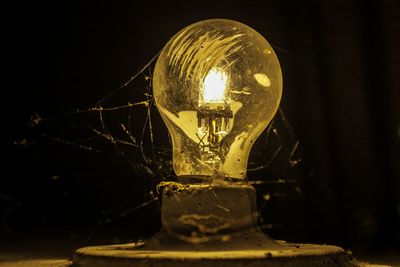 Close-up of illuminated light bulb