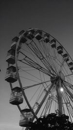 Low angle view of ferris wheel against clear sky