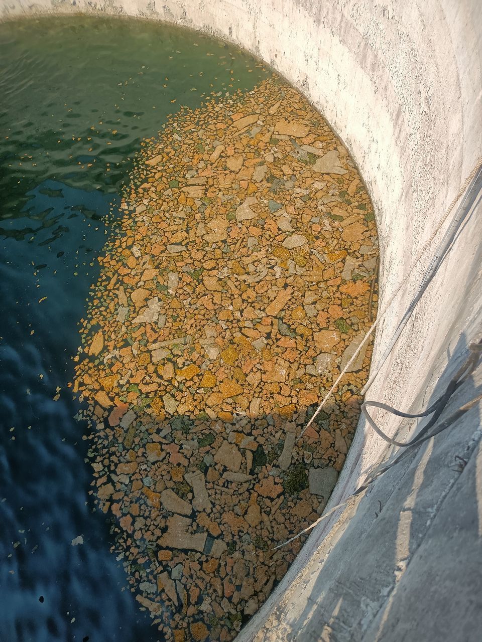 water, reflection, nature, no people, high angle view, day, rock, architecture, outdoors, leaf, sunlight, built structure, wall, infrastructure, river, transportation