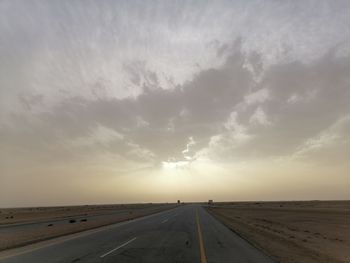 View of road against cloudy sky