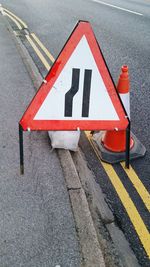 Close-up of road sign on street