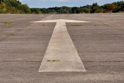 High angle view of arrow symbol on road