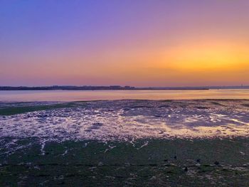 Scenic view of sea against sky during sunset