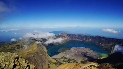 Panoramic view of volcanic landscape against blue sky