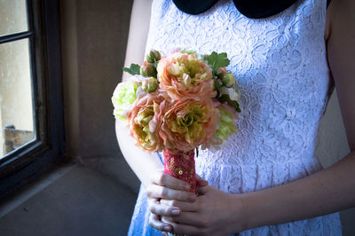 Close-up of hand holding bouquet