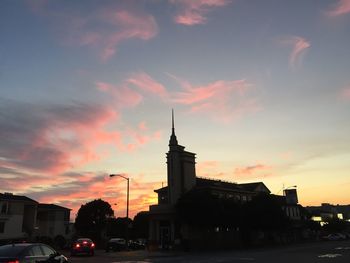 Traffic on road at sunset