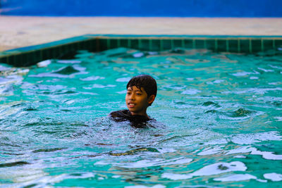 Portrait of boy in swimming pool