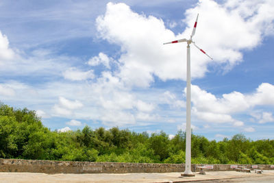 Traditional windmill against sky