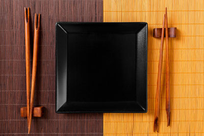 Asian food background with chopsticks top view with copy space.