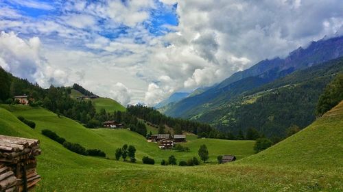 Panoramic view of green landscape against sky