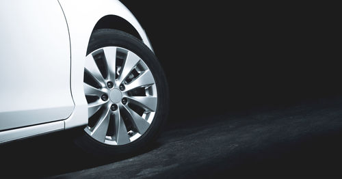 Close-up of vintage car wheel at night