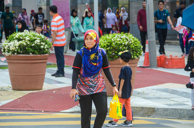 People walking on street in city