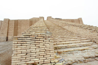 Low angle view of stone wall