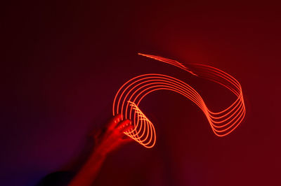 Close-up of light painting against colored background