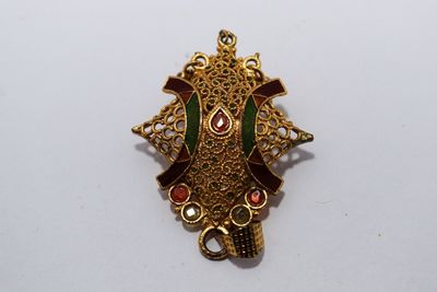 High angle view of ornate decoration on white background