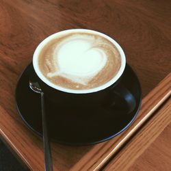 High angle view of cappuccino on table