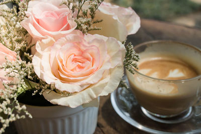 Close-up of rose in cup