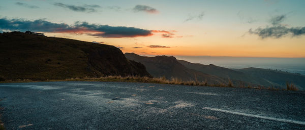 Scenic view of mountains against sky during sunset