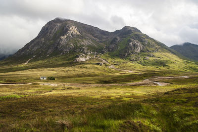 Scenic view of landscape and mountains against sky