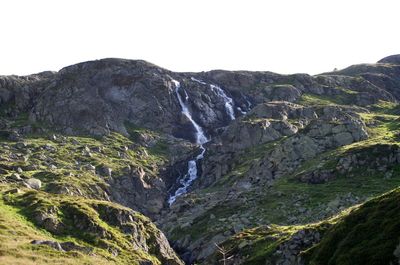 Scenic view of waterfall against clear sky