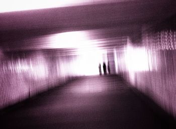 Woman walking in tunnel