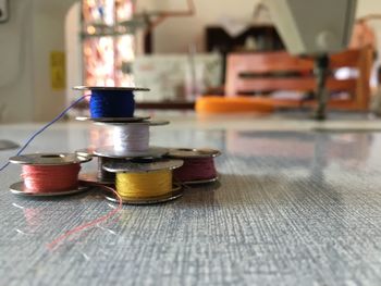 Close-up of colorful spools on table