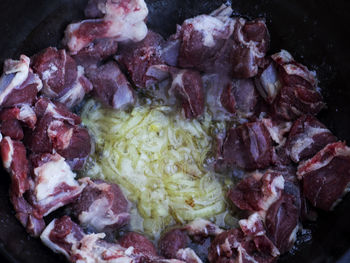 High angle view of meat in cooking pan