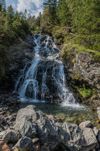 Close-up of waterfall against sky