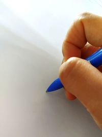 Close-up of hand holding paper