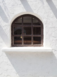 Low angle view of window of old building