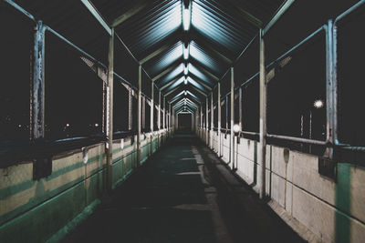 Illuminated footbridge at night