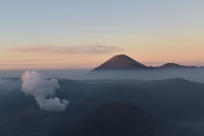 Scenic view of mountain range against sky during sunset