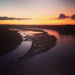 Scenic view of sunset over river