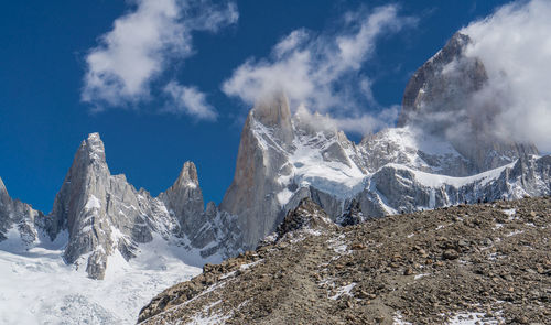 Panoramic view of snowcapped mountains against sky