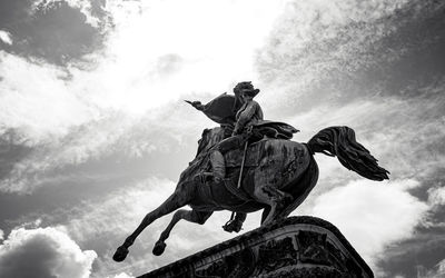 Low angle view of statue against sky