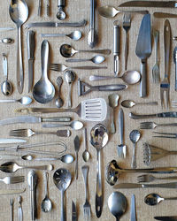 High angle view of kitchen cutlery flat lay on table 