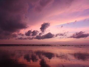 Scenic view of sea against romantic sky at sunset