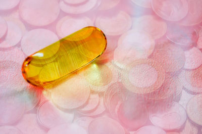 Close-up of cod liver oil capsule on table