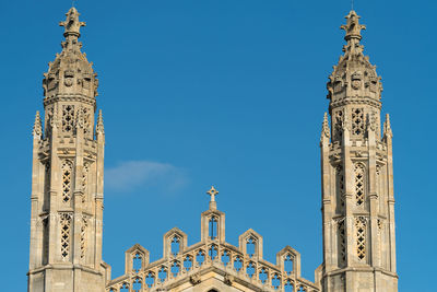 Low angle view of historical building against blue sky