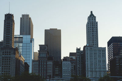 Skyscrapers in city against clear sky